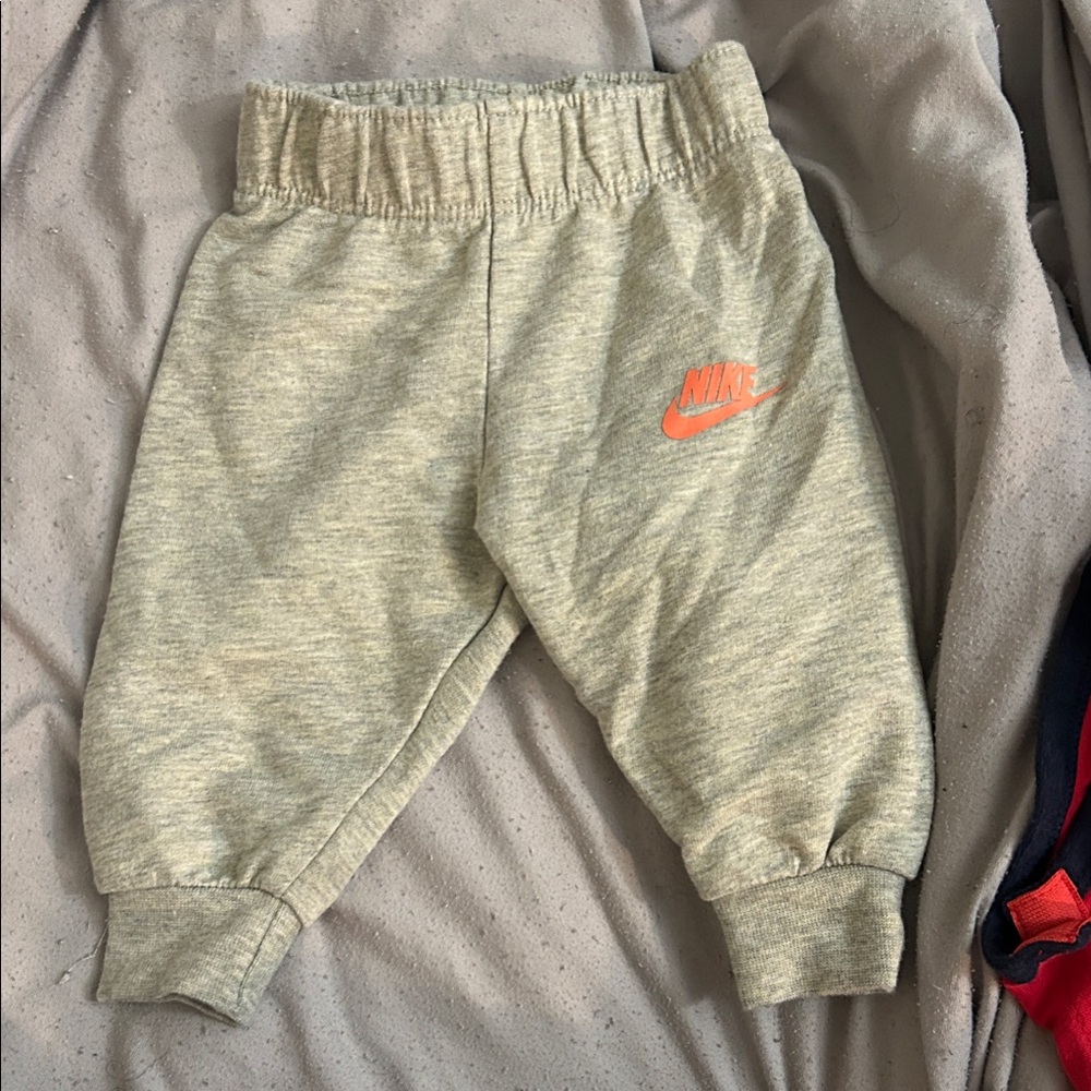 Nike Kids Light Gray Joggers with Orange Logo